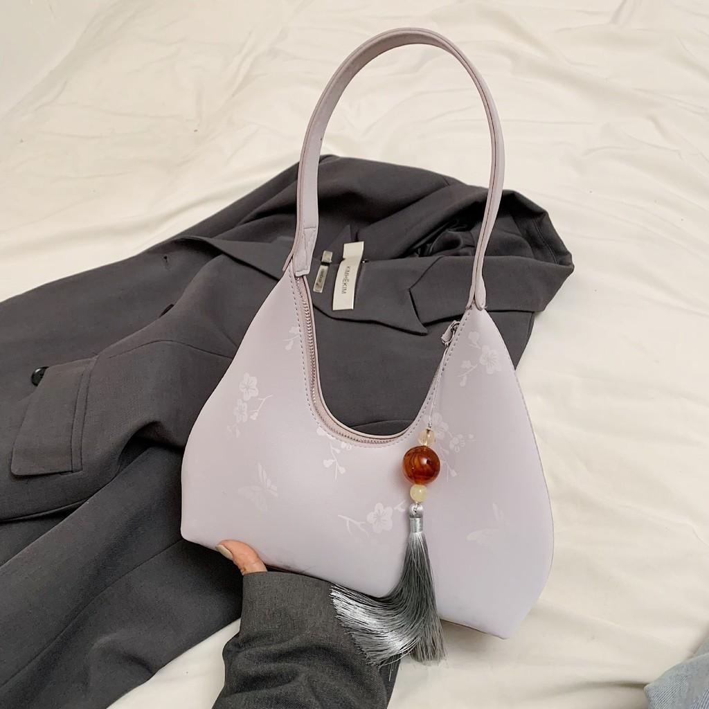 

IELGY Женская простая сумка в форме полумесяца в иностранном стиле, индивидуальная сумка через плечо, портативная текстурная сумка-багет (с подвеской) фиолетовый