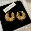 European and American Style Hollow Woven Twist Earrings Emerald Zircon Winding Shape Round Ear Buckle Retro Niche Earrings
