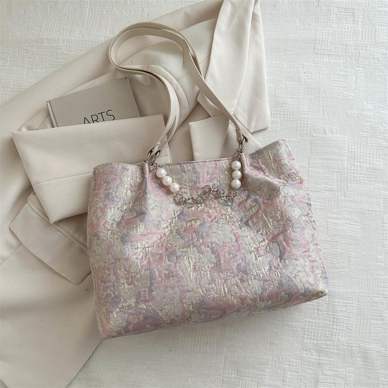 

Popular large-capacity commuter bag women s 2025 new jacquard fabric shoulder crossbody armpit bag fashion handbag рожевий