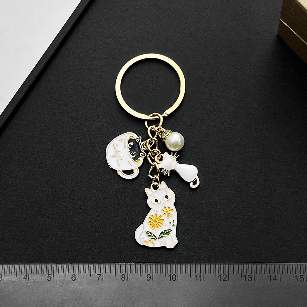 White Cat Pearl Teacup Keychain Ornament - Cartoon Drip Oil Finish
