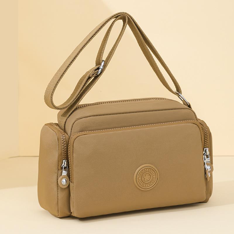 

Casual simple texture foreign style fashion small square bag summer new 2025 niche design women s shoulder messenger bag хаки