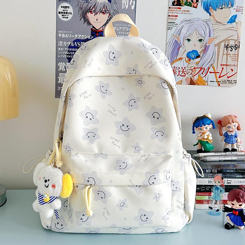 Nowy tornister jest wysokiej jakości, świeży, słodki i uroczy, a plecak w gwiazdki to lekki plecak podróżny dla uczniów gimnazjum.