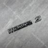 Fibbia Adesivi Emblema Logo Auto Distintivo Anteriore Auto Decalcomanie Posteriori Auto Per MAZDA2 2009-212 2013 2014 2015 16 172024 2025 2026 Demio