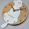 Stylish wooden pendulum clock featuring a toy poodle in white and cream. Silent, perfect for bedrooms, bedrooms, or any room.