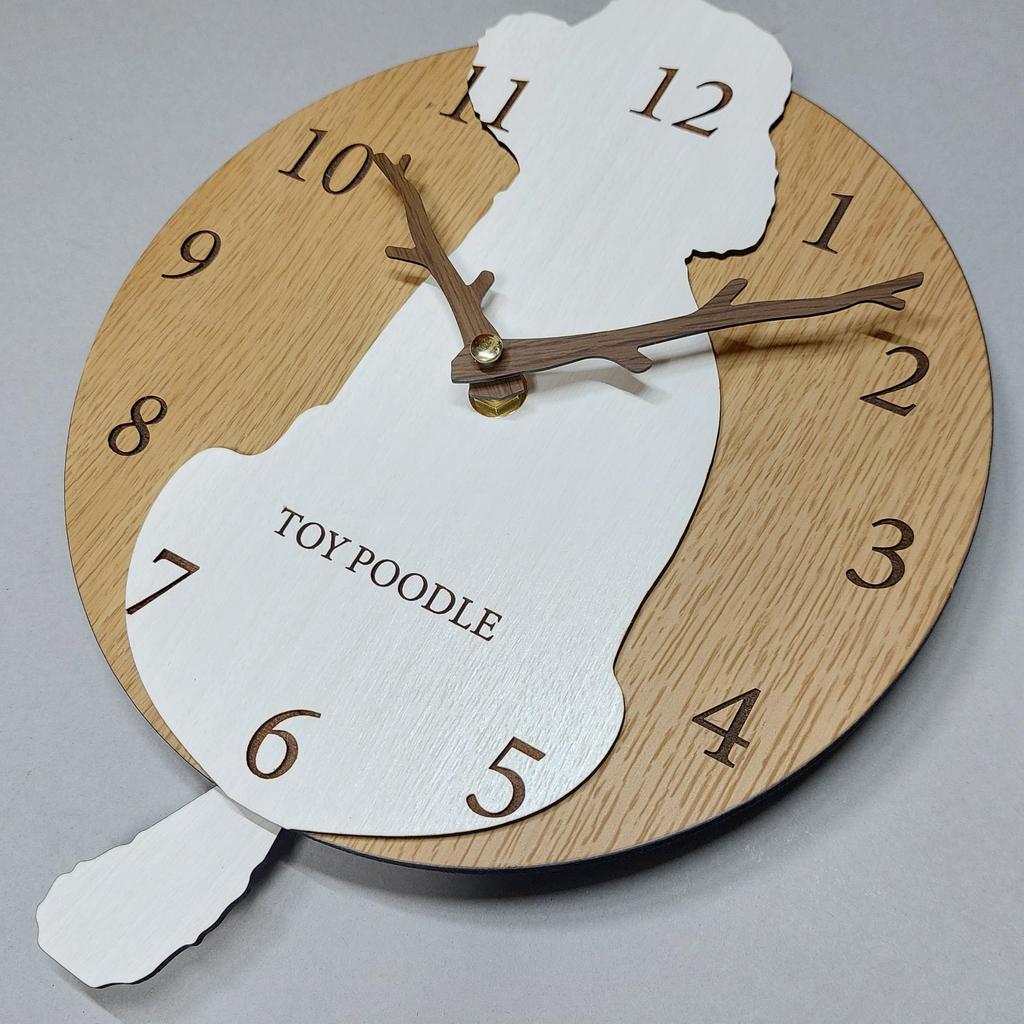 Stylish wooden pendulum clock featuring a toy poodle in white and cream. Silent, perfect for bedrooms, bedrooms, or any room.
