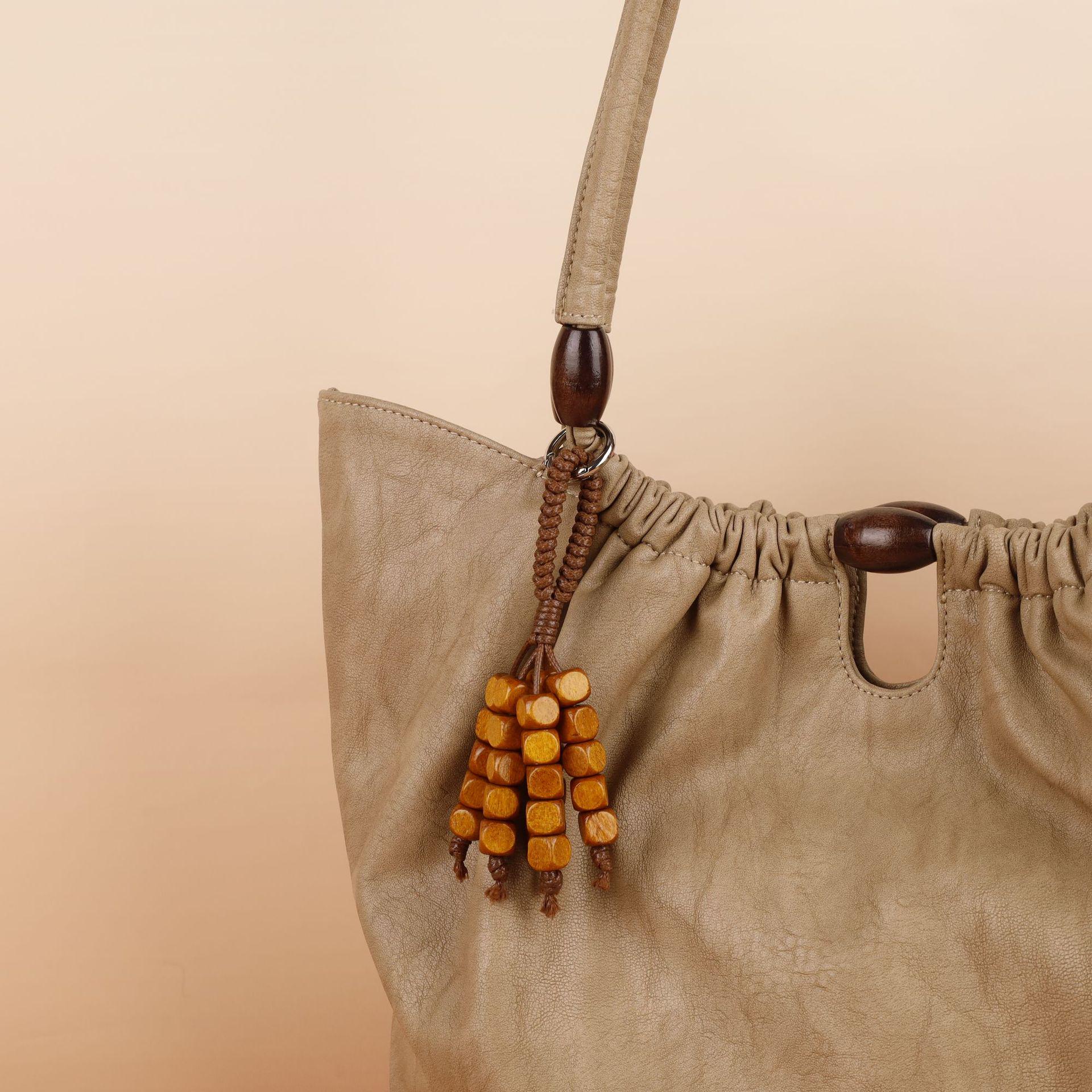 

Wenqi s Wish-Fulfilling Bodhi Seed Woven Charm Keychain