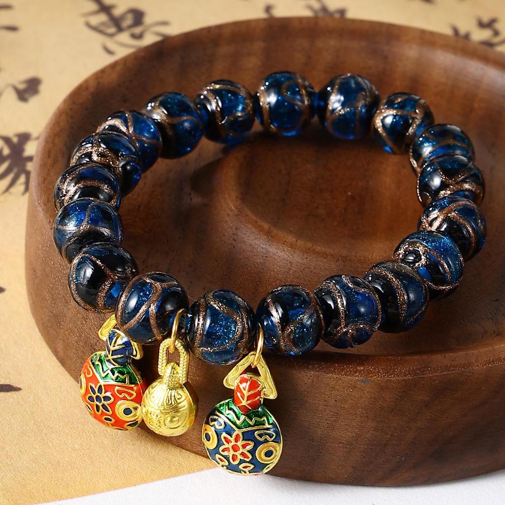 Aschgraues Pi Xiu Glasperlenarmband mit Blattgold und bunten Perlen