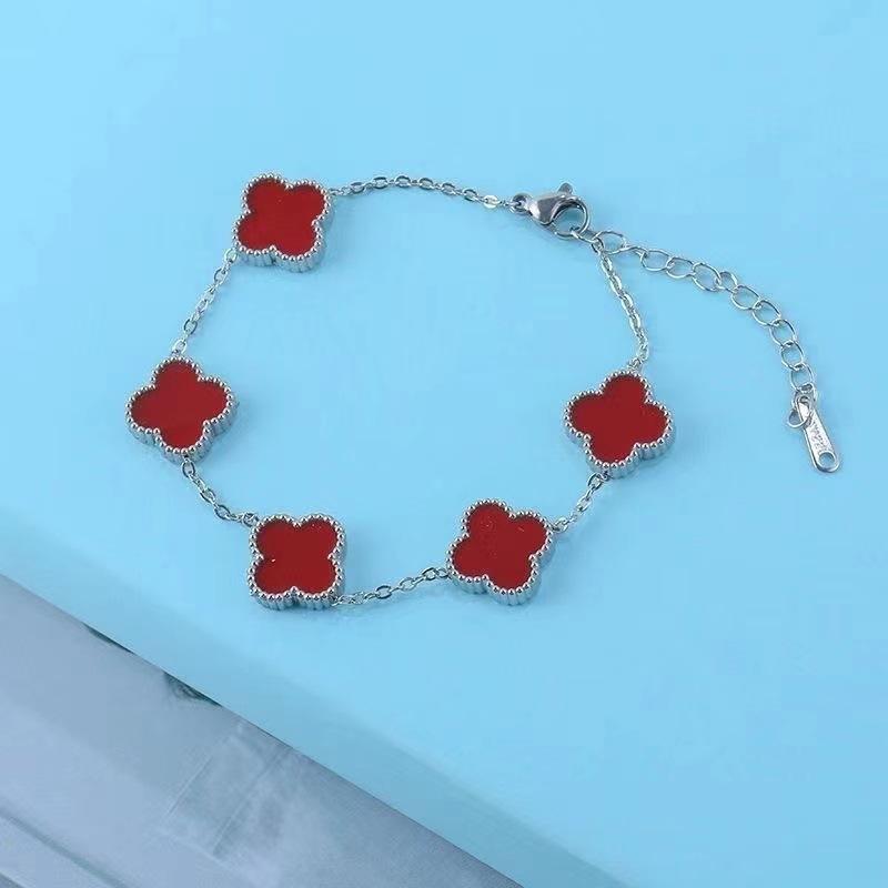 Bracciale da donna a fascia con conchiglia double-face e quadrifoglio, resistente ai colori, alla moda e di alta gamma