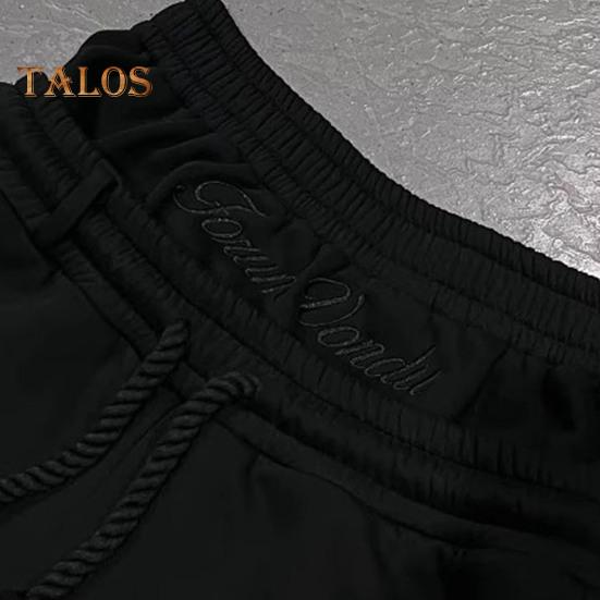 Męskie spodnie casualowe elastyczny pas regulowany sznurek długie spodnie z kieszeniami imitacja dwóch części nadruk w gwiazdki spodnie rekreacyjne