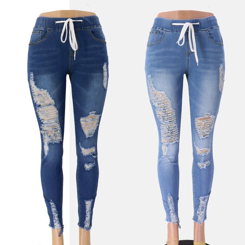 Jeans skinny con elastico in vita, vita media, strappati, allacciati in pizzo per donna