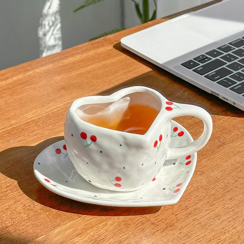 Hand-squeezed hand-painted cherries, exquisite retro heart-shaped ceramic coffee cups and saucers, afternoon teacups