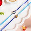 Nestasia Evil Eye Rakhi-Set für Bruder (2er Set) | Elegante Blaue Rakhi-Kombination für Bhaiya | Rakshabandhan-Geschenkkorb für Bhai - Roli-Chawal, Gruß