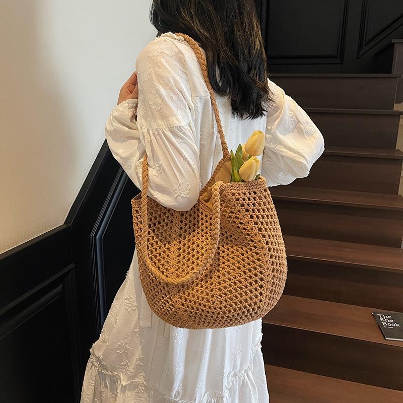 Woven bag women's large-capacity new spring and summer versatile leisure hollow shoulder vacation beach tote bag