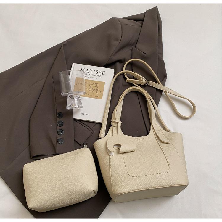 Premium foreign style portable bucket bag women's 2025 new fashion versatile shoulder bag simple commuter messenger bag