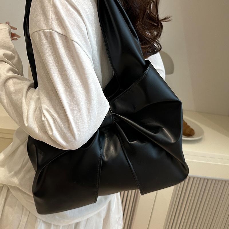 Korean version of casual underarm women's bag 2025 new simple bow design sense tote bag simple portable shoulder bag