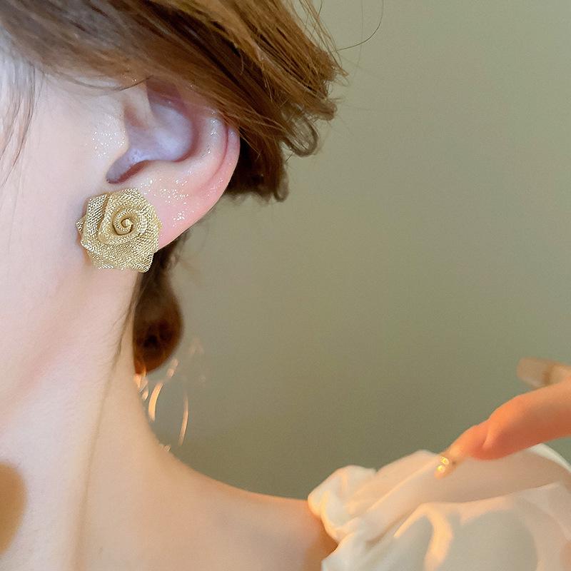 Name: "Retro Metallic Woven Flower Silver Stud Earrings"