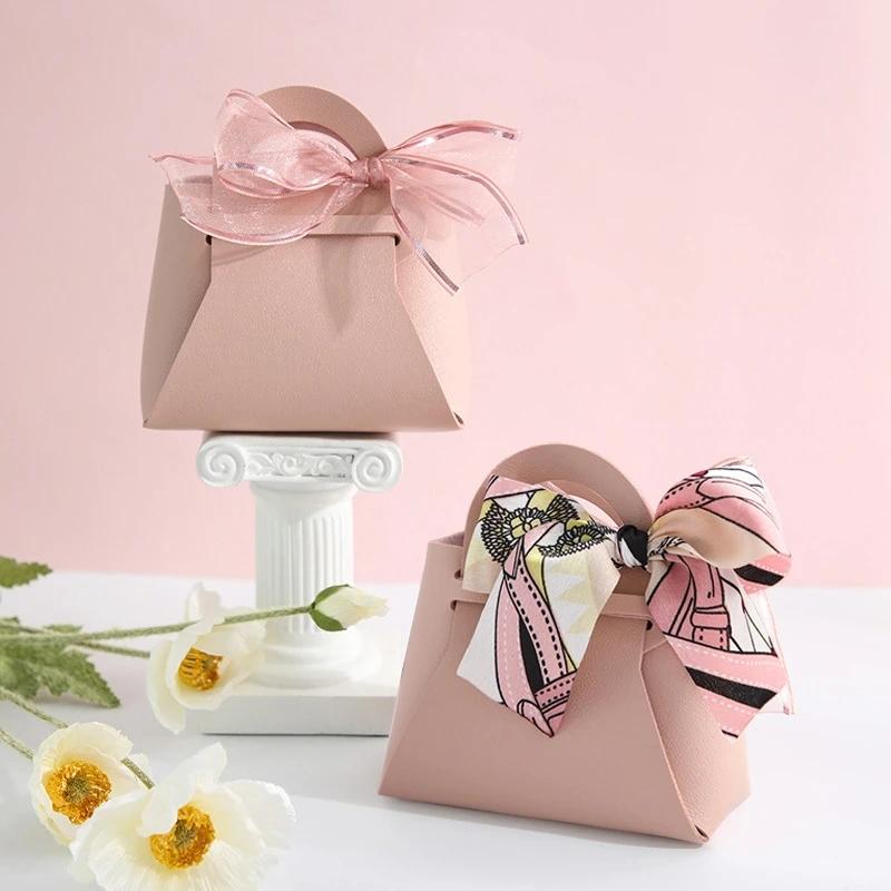 10 pezzi distribuiscono sacchetti regalo in pelle rosa, bomboniere per ospiti, mini borsetta con nastro, scatola per imballaggio di caramelle, decorazioni per feste