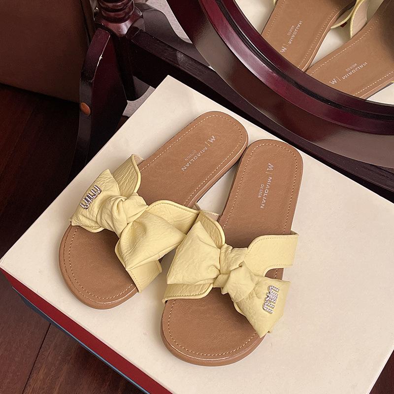Summer flat-bottomed cool slippers women's new fashion outer wear holiday versatile bow student seaside beach shoes