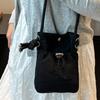 2025 New Japan and South Korea literary single shoulder messenger bag drawstring small bag niche sense fashion high value mobile phone nylon bag women