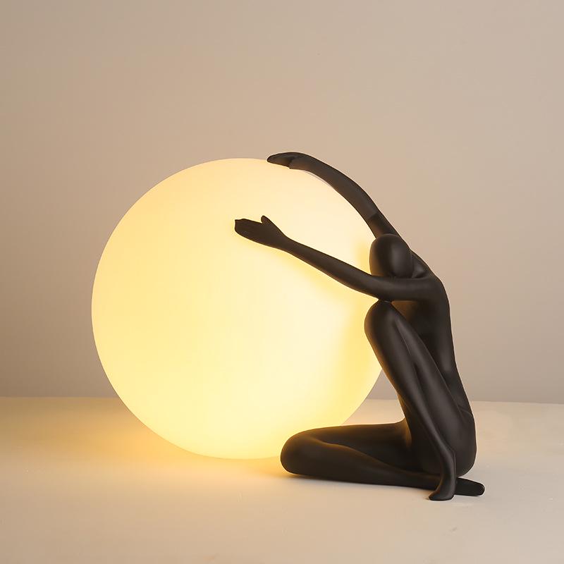 Modern Nordic Table Lamp Sculpture: Creative Doll Holding Luminous Ball for Bedroom and Living Room Decor