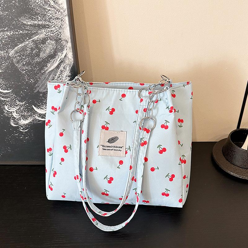 

Canvas large bag women s large capacity 2025 new work portable shoulder college student class bag commuter tote bag синій
