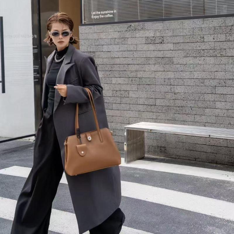 Leder-Umhängetasche große Kapazität vielseitig Herbst und Winter neu Achseltasche leichter Luxus Anhänger schlicht Nische Damen-Tasche