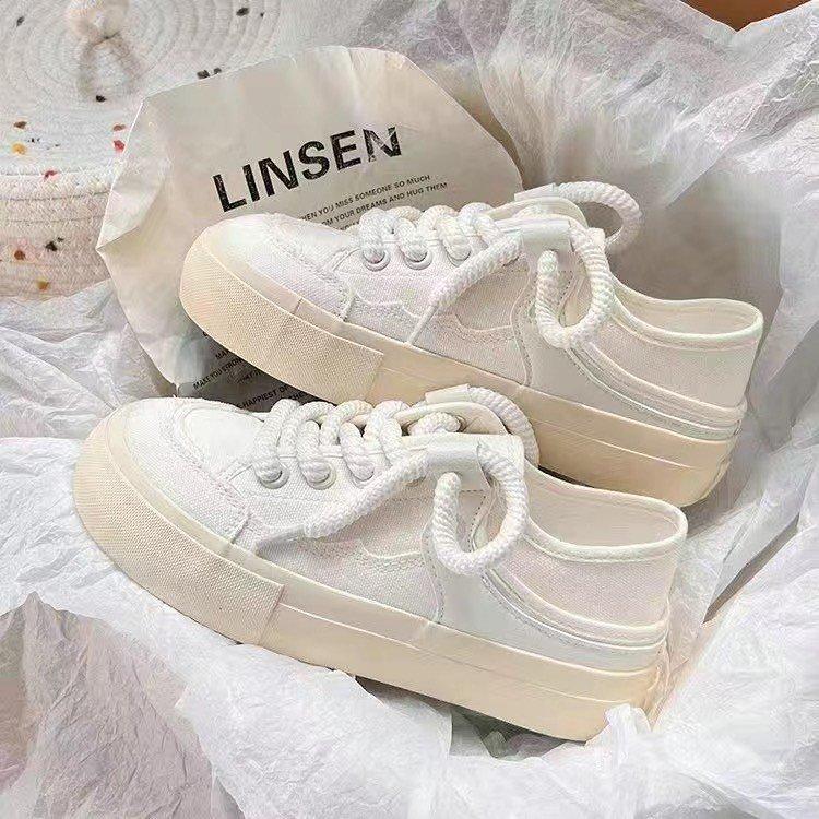 The heel can be stepped on half-towed canvas shoes for women's 2025 spring new niche original versatile little white shoes with skirts for women'