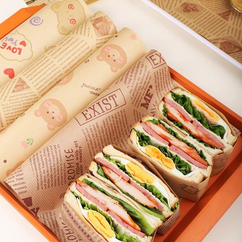 28x38cm Multifunktionale Haushaltsablage Spezielles Papier Kommerzielles Ölbeständiges Pad Papier Cartoon Muster Sandwichverpackung Burger Brot Backblech Papier