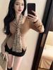 Elegant Leopard Print Waist-Cinching Long-Sleeve Pleated Top with Ribbon Detail