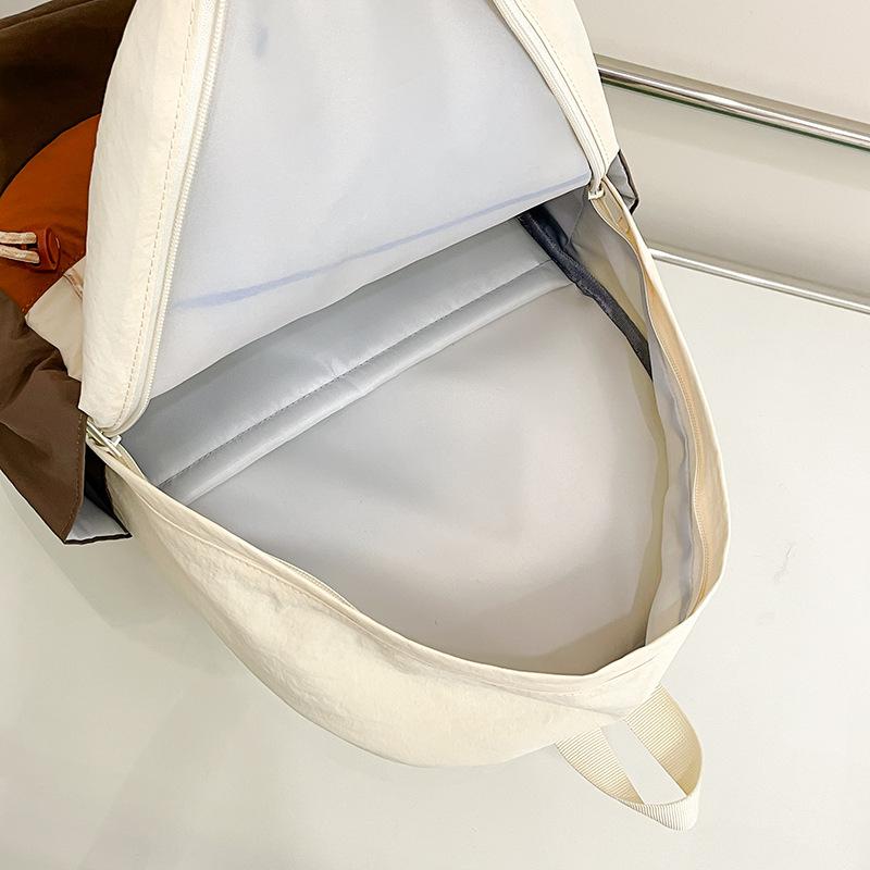 Simple schoolbag, Korean contrasting colors, new schoolbag, light travel and leisure backpack, high value, dirt-resistant