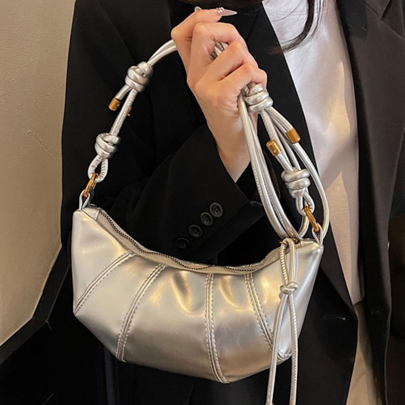 Retro niche horn dumpling bag 2025 new trendy Korean version niche mobile phone bag fashionable shoulder messenger women's bag