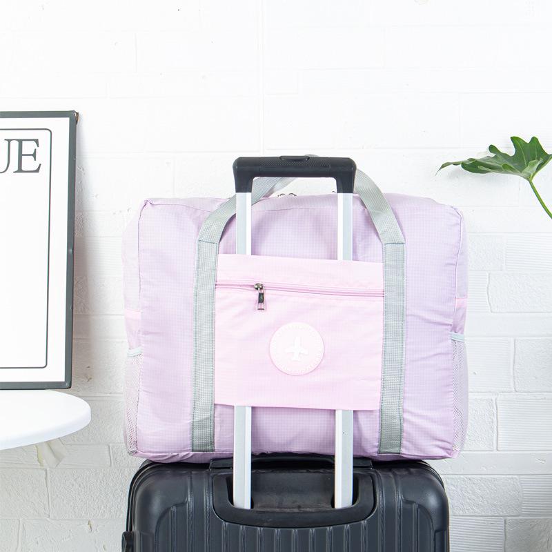 

Large Foldable Double-Layer Travel Bag: Spacious Handbag for Airplane, Sports, Moving, Maternity, or Business Trips. рожевий