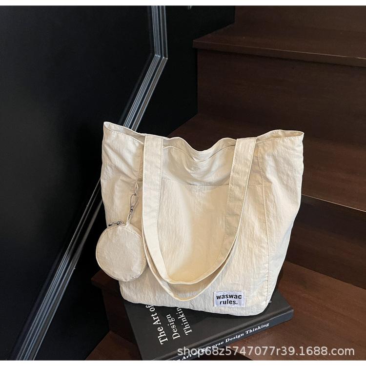 Japanese new waterproof nylon casual spring and summer shoulder bag women's design sense large-capacity commuter tote bag