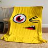 Yellow background with a winking cartoon face, red eye, and open mouth. for all seasons blanket lunch break throw gift
