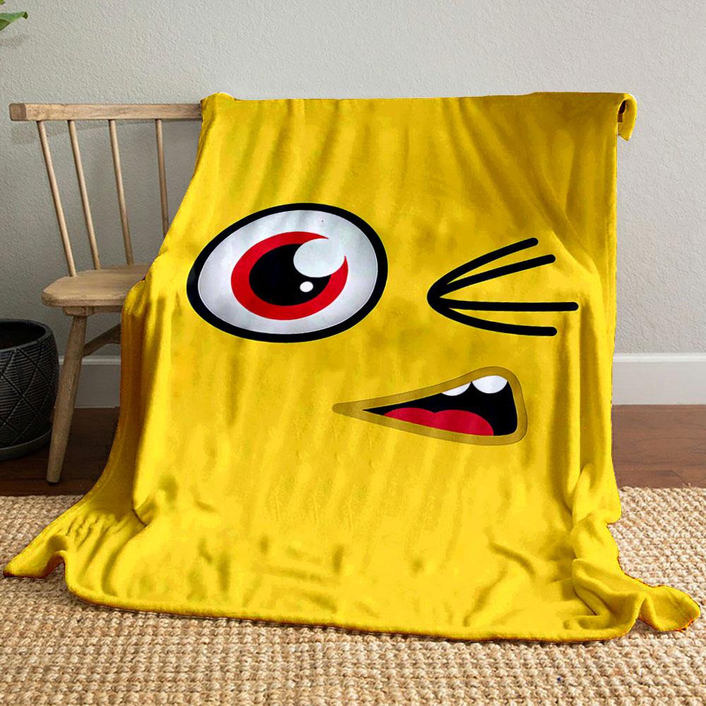 Yellow background with a winking cartoon face, red eye, and open mouth. for all seasons blanket lunch break throw gift