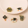 Elegant Unisex Graduation Brooch With Doctor Cap And Book Design Celebrating Knowledge