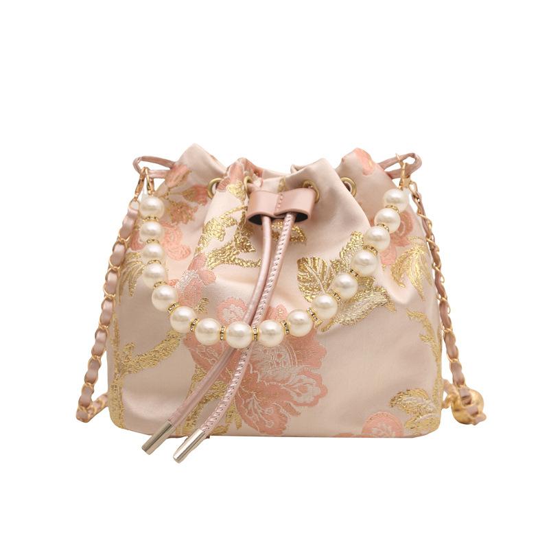 

Hand carry pearl bucket bag women s spring new Chinese embroidered shoulder bag simple texture messenger bag