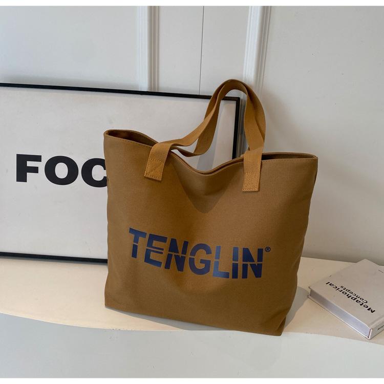 

Bags Women s Street Fashion Versatile Shoulder Bag Large Capacity Alphabet Canvas Bag Student Make-up Bag Tote Bag коричневый