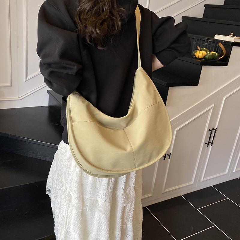 Canvas bag women's large-capacity new niche design sense summer shoulder messenger bag versatile commuter dumpling bag