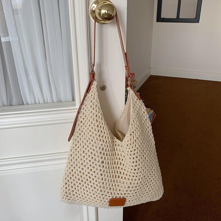 Seaside vacation beach bag weaving 2025 new fashion versatile hollow knitted bag large capacity shoulder armpit bag