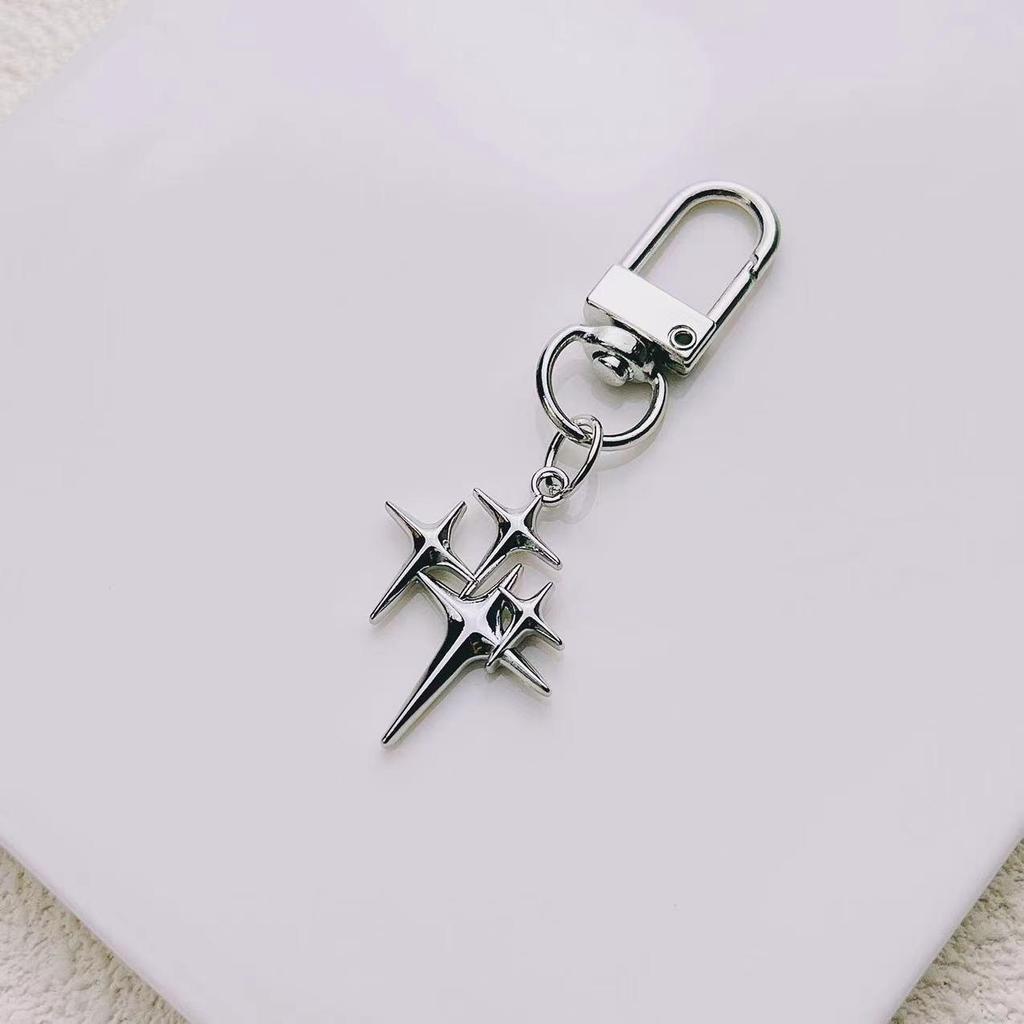 Elegant Star and Moon Hollow Keychain - Unisex Fashion Bag Pendant.