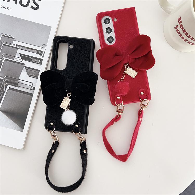 Applicable to Samsung ZFlip6 folding plush bow mobile phone case zflip5/4 portable lanyard anti-drop protective case