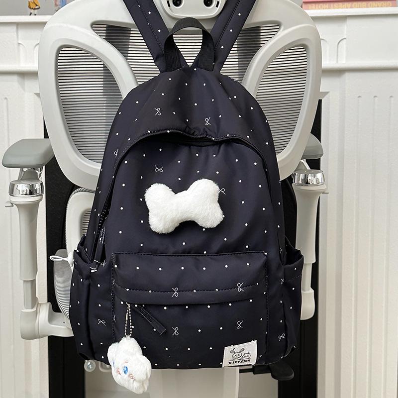 Polka Dot Bow Backpack for Teen Girls: Stylish and Versatile Schoolbag for Middle and High School Students.