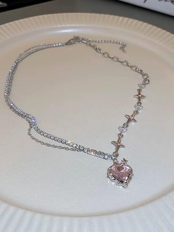 A Single-piece Pink, Understated Luxury Necklace for Women. Features a Minimalist Style with Diamond, Heart, and Star Patterns,