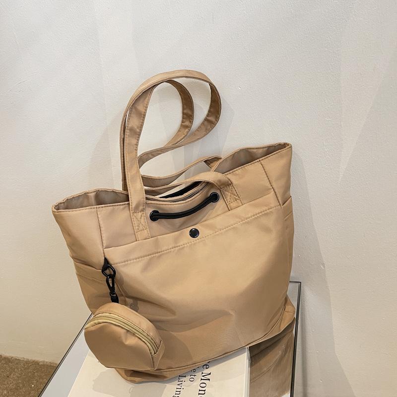 Nova bolsa grande, bolsa tote, mochila escolar para meninos e meninas, bolsa de ombro impermeável, bolsa de mão da moda e versátil maré