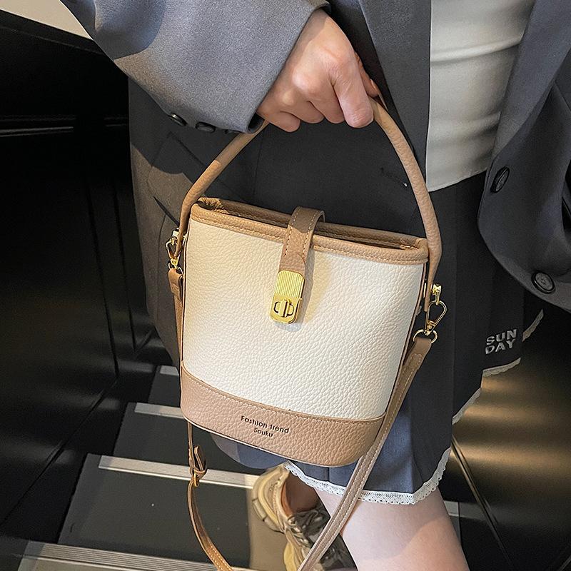 High-end niche contrasting color small bucket bag women's 2025 new Korean version fashion one-shoulder portable messenger bag