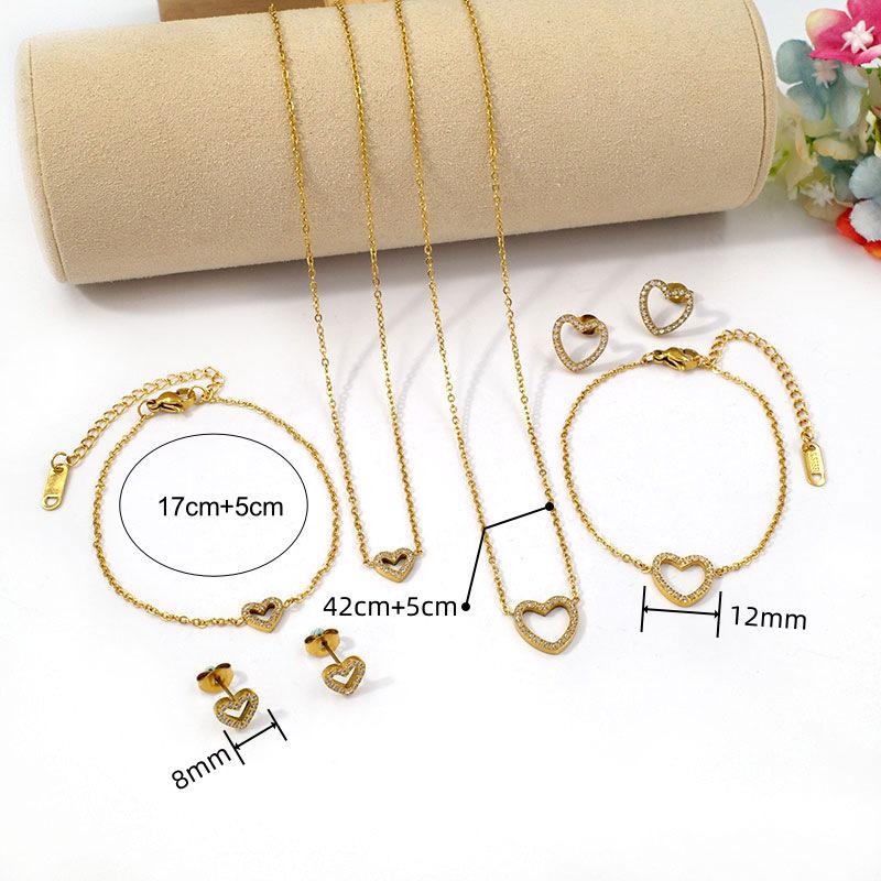 European Diamond-Accented Heart Jewelry Set: Necklace, Bracelet & Earrings in Titanium Steel for Women's Luxurious Style.