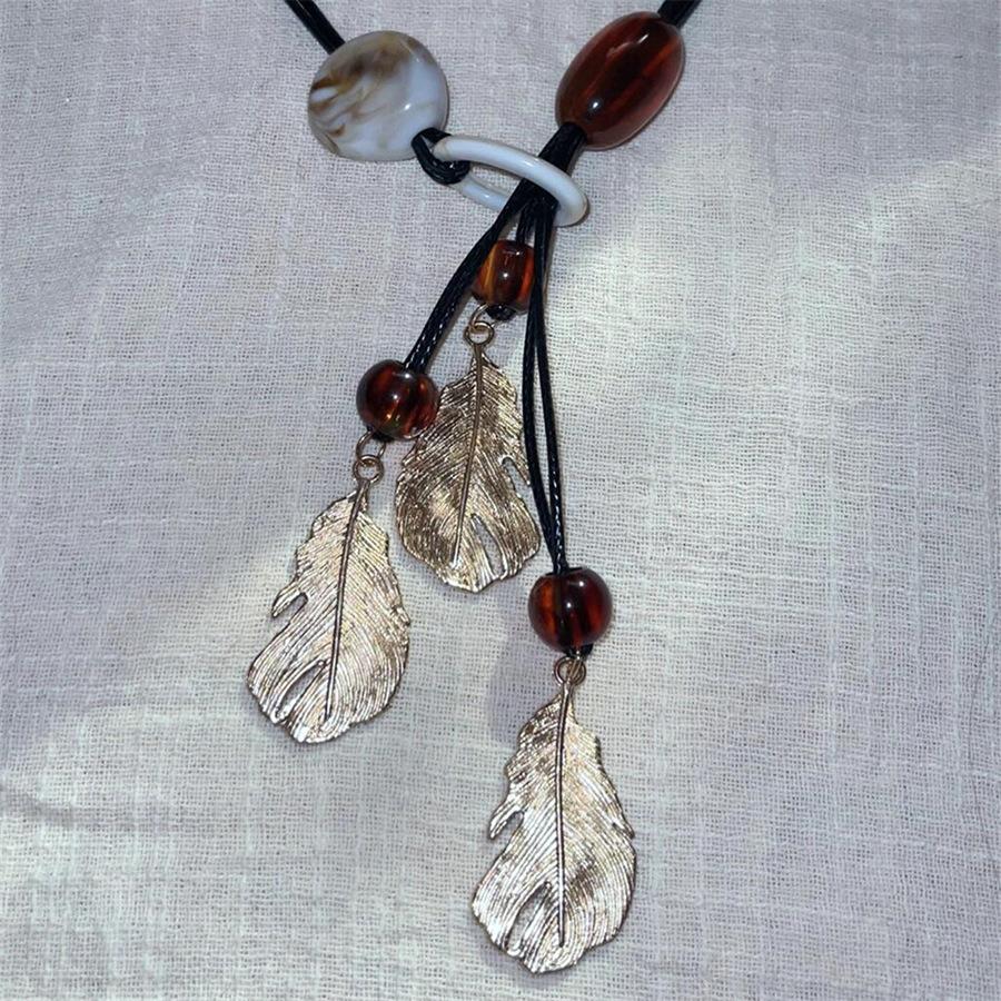 

Кулон в виде листа из смолы, ожерелье с бахромой, ретро этнический темперамент, цепочка для свитера, нишевая личность, элитная бижутерия, женщины