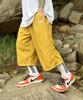 PEACEOFMIND Nylon Double-Pleat Bermuda Shorts (Mustard)