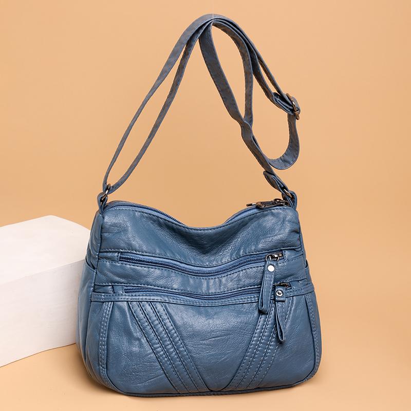Damska skórzana torba dla matki w średnim wieku. Torba na ramię typu crossbody. Torba z wieloma kieszeniami